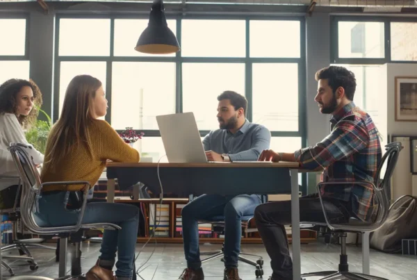 a marketing team discussing strategy in a modern office setting.